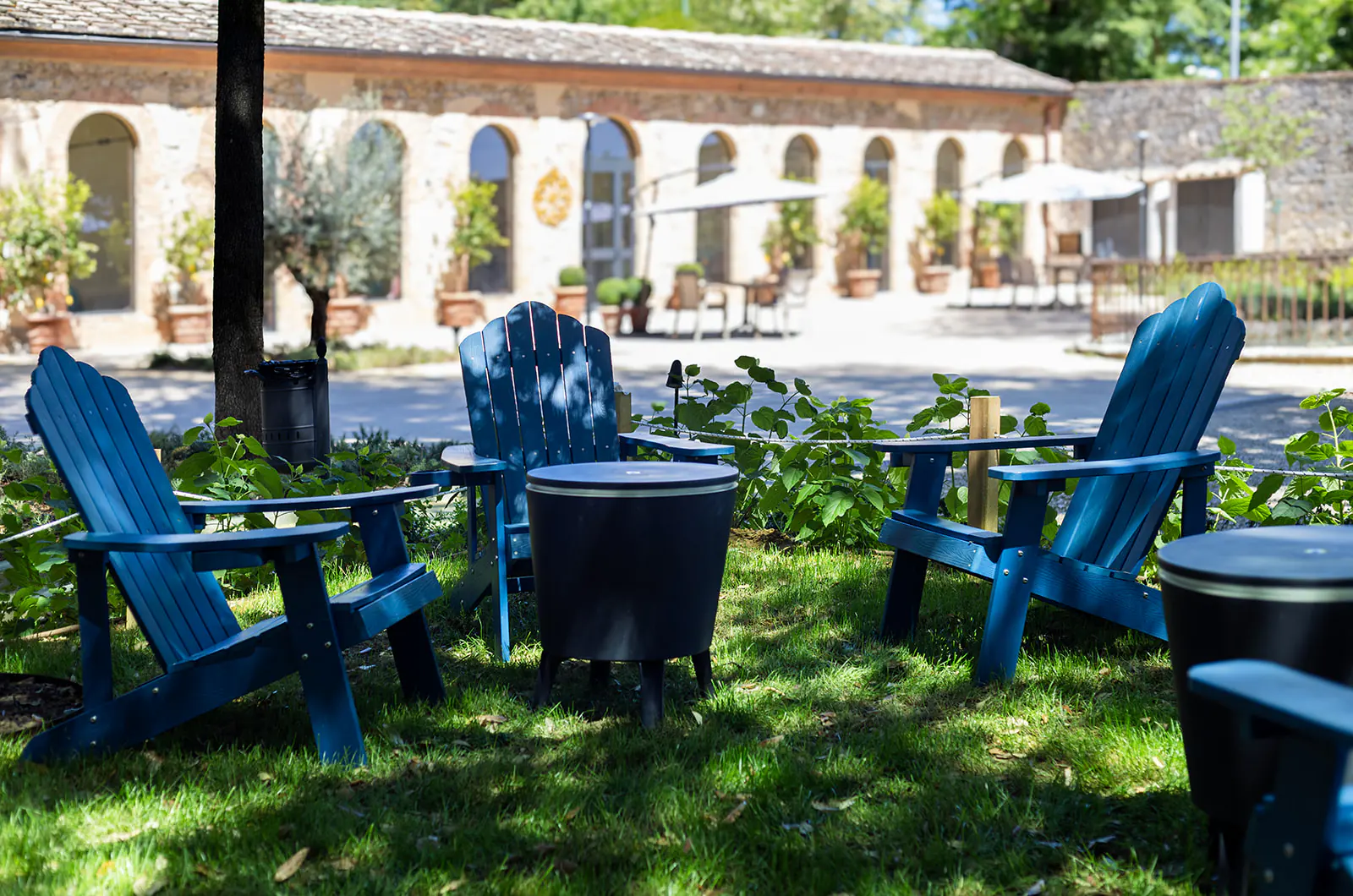 Blue garden chairs outside Guild Siena in Tuscany